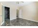 This bedroom has sleek, dark floors, a ceiling fan, and a sound proofing room at 63 Crescent Palm Ct, Henderson, NV 89002