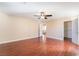 Large bedroom featuring wood floors, ceiling fan with light, and a walk-in closet at 63 Crescent Palm Ct, Henderson, NV 89002