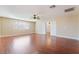 Spacious bedroom features wood-look floors and natural light from the window at 63 Crescent Palm Ct, Henderson, NV 89002