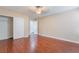 Spacious bedroom featuring wood floors, closet, and a ceiling fan with light at 63 Crescent Palm Ct, Henderson, NV 89002