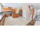 Spacious kitchen features stainless steel appliances, center island, tile backsplash, and marble floors at 63 Crescent Palm Ct, Henderson, NV 89002