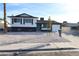 Charming home featuring a two-car garage and a cheerful, bright blue front door at 6317 Clarice Ave, Las Vegas, NV 89107