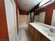 Charming bathroom featuring a combined shower-tub and vanity with sink, offering a serene and well-lit space at 6493 Za Zu Pitts Ave # 101, Las Vegas, NV 89122