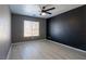 Neutral bedroom with large window offers bright natural light and tiled flooring at 6493 Za Zu Pitts Ave # 101, Las Vegas, NV 89122