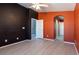 Spacious bedroom features neutral tiled floors, modern ceiling fan, and convenient ensuite bathroom at 6493 Za Zu Pitts Ave # 101, Las Vegas, NV 89122