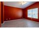 Comfortable bedroom with tiled floor, ceiling fan, and natural light from the window at 6493 Za Zu Pitts Ave # 101, Las Vegas, NV 89122