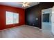 Bright bedroom offers tiled floors, a ceiling fan, and natural light through a large window at 6493 Za Zu Pitts Ave # 101, Las Vegas, NV 89122