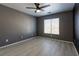 Bedroom featuring a window with blinds and tiled floors at 6493 Za Zu Pitts Ave # 101, Las Vegas, NV 89122