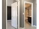 Hallway with tiled floors leads to the bath and bedroom at 6493 Za Zu Pitts Ave # 101, Las Vegas, NV 89122
