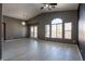 Spacious living room featuring neutral tones, large windows and tile flooring at 6493 Za Zu Pitts Ave # 101, Las Vegas, NV 89122