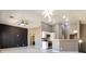 Open concept living area featuring modern lighting, sleek flooring and neutral tones at 6493 Za Zu Pitts Ave # 101, Las Vegas, NV 89122