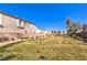 Exterior shot of community park with grass, benches, trees, and walking path, a lovely outdoor space for residents at 6637 Rockhouse St, North Las Vegas, NV 89086