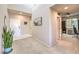 Inviting foyer with high ceilings, neutral carpet, and a view into a home office or den on the right at 6637 Rockhouse St, North Las Vegas, NV 89086