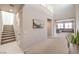 Grand two-story entryway with staircase, high ceilings, and a glimpse into the comfortable living room at 6637 Rockhouse St, North Las Vegas, NV 89086