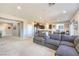 Open-concept living room with a seamless transition to the kitchen and dining area, perfect for modern living at 6637 Rockhouse St, North Las Vegas, NV 89086