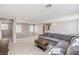 Upstairs living room with plush carpet flooring, large sectional sofa and plenty of natural light at 6637 Rockhouse St, North Las Vegas, NV 89086