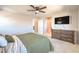 Comfortable main bedroom with a ceiling fan, carpet flooring and a TV at 6637 Rockhouse St, North Las Vegas, NV 89086