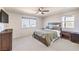 This main bedroom features a ceiling fan, large window and carpet flooring at 6637 Rockhouse St, North Las Vegas, NV 89086