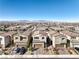 Street view of modern homes in a suburban neighborhood with mountain views in the distance at 6637 Rockhouse St, North Las Vegas, NV 89086