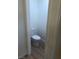 Half bathroom with neutral color flooring and white toilet at 6965 Coral Rock Dr, Las Vegas, NV 89108