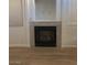 Clean looking fireplace in a cozy living area at 6965 Coral Rock Dr, Las Vegas, NV 89108
