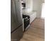 Well-lit kitchen featuring stainless steel appliances and plenty of cabinet space at 6965 Coral Rock Dr, Las Vegas, NV 89108
