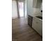 Bright kitchen area with stainless steel dishwasher and countertop with sink at 6965 Coral Rock Dr, Las Vegas, NV 89108