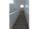 Carpeted staircase ascends to the next level, with white walls and natural light at 6965 Coral Rock Dr, Las Vegas, NV 89108