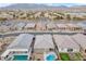 Stunning aerial view of homes with pools and putting greens in a well-planned Nevada community at 71 Gosia Grove Ave, North Las Vegas, NV 89031