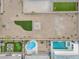 Aerial view of several backyards, showcasing a pool and desert landscaping at 71 Gosia Grove Ave, North Las Vegas, NV 89031