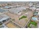Aerial view of multiple backyards featuring pools, putting greens, and gathering spots at 71 Gosia Grove Ave, North Las Vegas, NV 89031