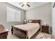 Cozy bedroom featuring a comfortable bed, neutral color palette, and ample natural light from the window at 71 Gosia Grove Ave, North Las Vegas, NV 89031