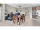Inviting dining area with wooden table set and adjacent workspace featuring dual monitors at 71 Gosia Grove Ave, North Las Vegas, NV 89031