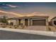 Charming single-story home with desert landscaping and a spacious two-car garage at 71 Gosia Grove Ave, North Las Vegas, NV 89031
