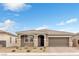 Beautiful single-story home with well-maintained landscaping and a two-car garage at 71 Gosia Grove Ave, North Las Vegas, NV 89031