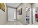 Bright and airy foyer featuring tiled floors, neutral walls, and decorative artwork at 71 Gosia Grove Ave, North Las Vegas, NV 89031
