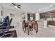 Open kitchen and dining area with tile floors and stylish decor throughout at 71 Gosia Grove Ave, North Las Vegas, NV 89031