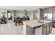 Open-concept kitchen with a large island, stainless steel appliances and adjacent dining area at 71 Gosia Grove Ave, North Las Vegas, NV 89031