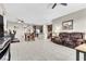Open-concept living space with a dining area, kitchen, and comfortable seating, perfect for entertaining at 71 Gosia Grove Ave, North Las Vegas, NV 89031