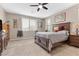 Serene main bedroom with a king-sized bed, neutral tones, and soft natural light from the window at 71 Gosia Grove Ave, North Las Vegas, NV 89031