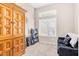 Bedroom with couch and window providing ample natural light at 7912 Purple Mountain Ave, Las Vegas, NV 89131