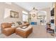 Spacious living room featuring neutral colors, high ceilings, and modern furnishings at 7912 Purple Mountain Ave, Las Vegas, NV 89131