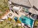 Aerial view of backyard featuring a pool, jacuzzi, dining area, and balcony with lounge seating at 837 Roseberry Dr, Las Vegas, NV 89138
