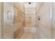 Tiled walk-in shower with a built-in bench and niche for toiletries at 837 Roseberry Dr, Las Vegas, NV 89138