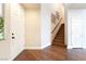 Welcoming entryway featuring hardwood floors, staircase with wood banister, and plenty of natural light at 837 Roseberry Dr, Las Vegas, NV 89138