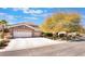 Spacious three car garage home exterior boasts well-maintained landscaping and a charming stone facade at 837 Roseberry Dr, Las Vegas, NV 89138