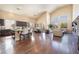 Open concept living space with modern kitchen, dining area, and living room featuring high ceilings at 837 Roseberry Dr, Las Vegas, NV 89138