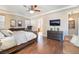 Comfortable main bedroom with hardwood floors, a large bed, and a view to the ensuite bathroom at 837 Roseberry Dr, Las Vegas, NV 89138