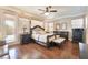 Bright main bedroom with wooden floors, a ceiling fan, and a view to the outside at 837 Roseberry Dr, Las Vegas, NV 89138