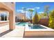 Beautiful backyard oasis with a pool, spa, and waterfall feature, ideal for outdoor entertaining at 837 Roseberry Dr, Las Vegas, NV 89138